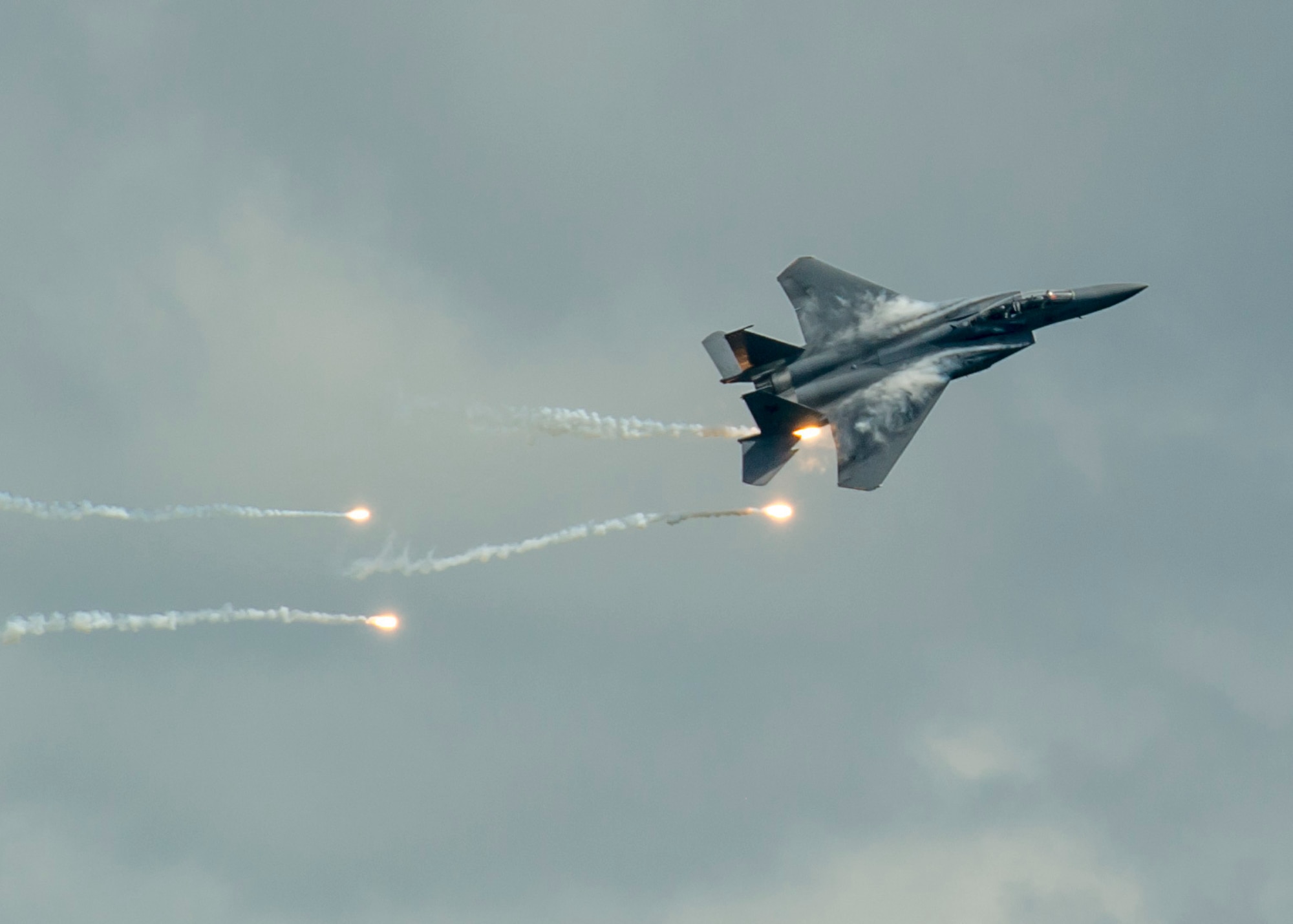 A Republic of Singapore air force F-15SG Strike Eagle deploys flares as part of an aerial demonstration during the Singapore International Airshow at Changi International Airport, Singapore, Feb. 18, 2016. Singapore is a strong partner with the U.S. that provides mutual training and cooperation opportunities between the two nations’ military forces. (U.S. Air Force photo by Capt. Raymond Geoffroy/Released)