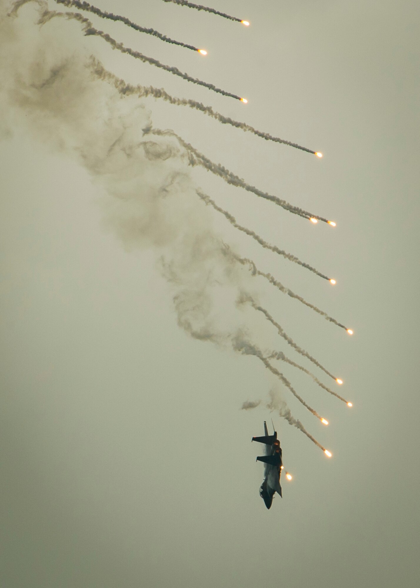 A Republic of Singapore air force F-15SG Strike Eagle deploys flares as part of an aerial demonstration during the Singapore International Airshow at Changi International Airport, Singapore, Feb. 18, 2016. Singapore is a strong partner with the U.S. that provides mutual training and cooperation opportunities between the two nations’ military forces. (U.S. Air Force photo by Capt. Raymond Geoffroy/Released)