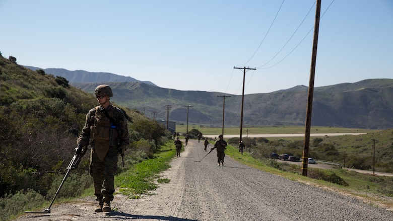 Lance Cpl. Scott Bone sweeps for possible IEDs with a compact metal detector during counter-IED training at Marine Corps Base Camp Pendleton, Feb. 12, 2016. This training is a part of a new Counter-IED Training Class developed by the Marine Corps Engineer School, Defeat the Device Branch, to improve operational readiness. Bone is a combat engineer with Company A, 1st Combat Engineer Battalion, 1st Marine Division.