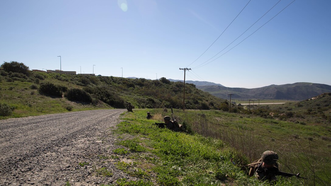 Marines set security while waiting for Explosive Ordnance Disposal technicians during counter-IED training at Marine Corps Base Camp Pendleton, Feb. 12, 2016. This is a new C-IED training curriculum developed by Marine Corps Engineer School, Defeat the Device Branch. The Marines conducting the training are with Company A, 1st Combat Engineer Battalion, 1st Marine Division.