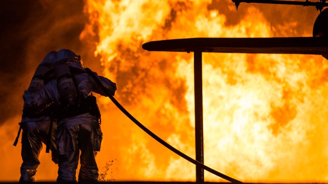 Marines extinguish a fire during a controlled burn training exercise aboard Marine Corps Air Station Beaufort Feb. 17. The Marines with Aircraft Rescue and Firefighting are trained to be ready to respond for an emergency within three minutes. The Marines are with ARFF. 