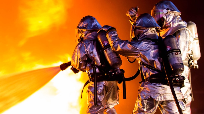 Marines extinguish a fire during a controlled burn training exercise aboard Marine Corps Air Station Beaufort Feb. 17. Training with live fires not only makes the Marines train for a real life scenario, but also ensures that they understand the importance of their specialty to the air station. The Marines are with Aircraft Rescue and Firefighting. 