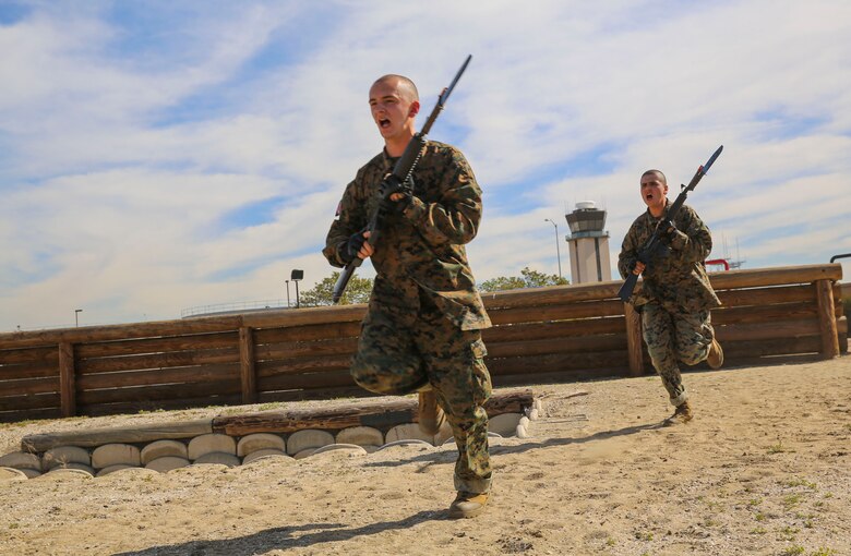 Recruits of Alpha Company, 1st Recruit Training Battalion, rush to the next obstacle during the Bayonet Assault Course I event at Marine Corps Recruit Depot San Diego, Feb. 10. Recruits were instructed to move quickly during the course to simulate maneuvering around dangerous environments during combat situations. Annually, more than 17,000 males recruited from the Western Recruiting Region are trained at MCRD San Diego. Alpha Company is scheduled to graduate April 22.