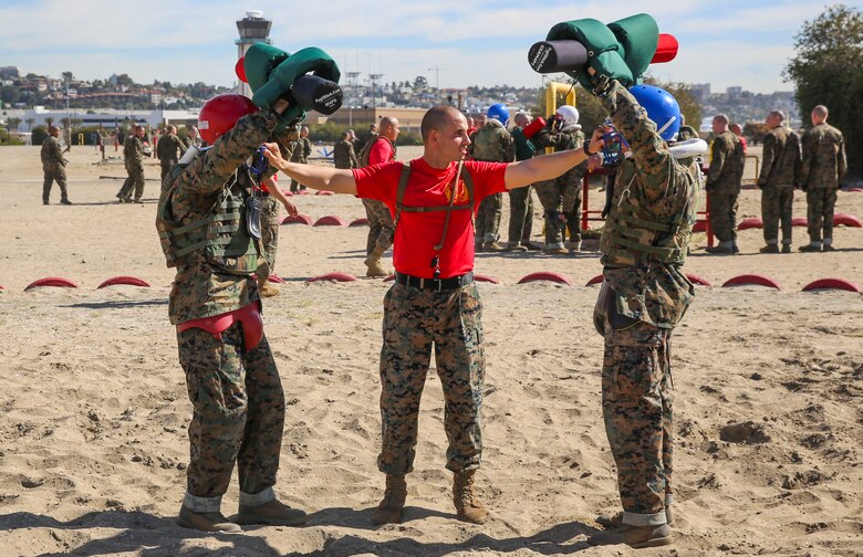 Two recruits of Alpha Company, 1st Recruit Training Battalion, prepare to battle each other during the Pugil Sticks I event at Marine Corps Recruit Depot San Diego, Feb. 10. Recruits are paired up against another recruit who is similar in height and weight so there aren’t any advantages during the match. Annually, more than 17,000 males recruited from the Western Recruiting Region are trained at MCRD San Diego. Alpha Company is scheduled to graduate April 22.