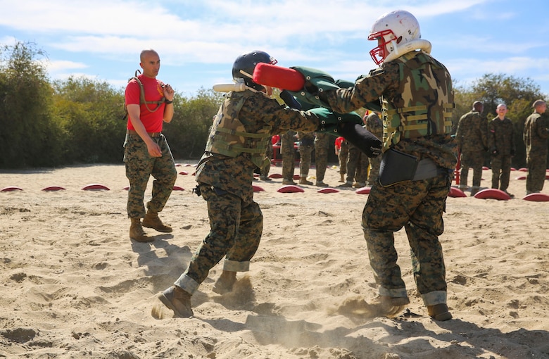 Recruits of Alpha Company, 1st Recruit Training Battalion, spar against each other during the Pugil Sticks I event at Marine Corps Recruit Depot San Diego, Feb. 10. Maintaining balance and using proper technique was critical to winning of the match. Annually, more than 17,000 males recruited from the Western Recruiting Region are trained at MCRD San Diego. Alpha Company is scheduled to graduate April 22.