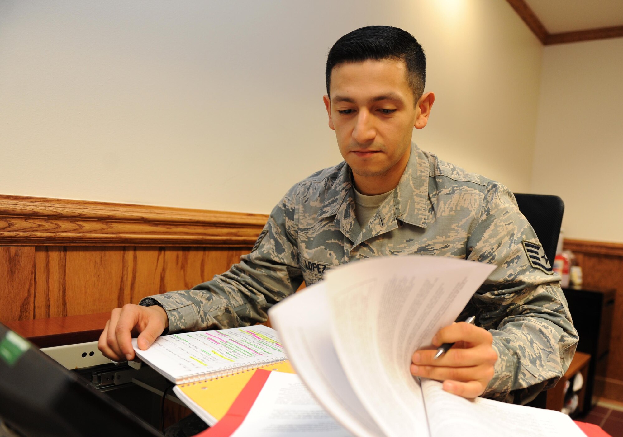 Staff Sgt. Abraham Lopez, 335th Training Squadron student, reviews study material during the personnel apprentice course at Wolfe Hall Feb. 17, 2016, Keesler Air Force Base, Miss. Lopez graduated with perfect scores throughout the course. He will report to his follow-on duty station with the 802nd Force Support Squadron, Joint Base San Antonio-Lackland, Texas.  (U.S. Air Force photo by Kemberly Groue)