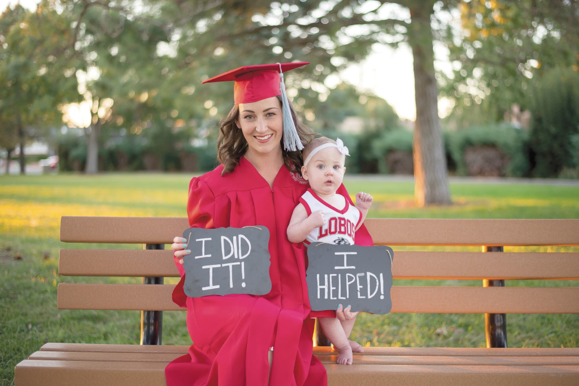 Air Force spouse Caitlin Coppotelli poses with her daughter, Meredith, after graduating from the University of New Mexico with help from a Kirtland Spouses’ Club scholarship and moral support. (Courtesy photo)