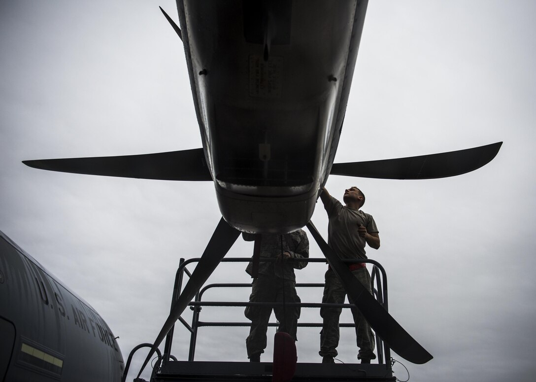 Airmen remove the propeller on a C-130J Super Hercules aircraft while conducting pre-flight maintenance on Pope Army Airfield, N.C., Feb. 4, 2016. Air Force photo by Staff Sgt. Marianique Santos