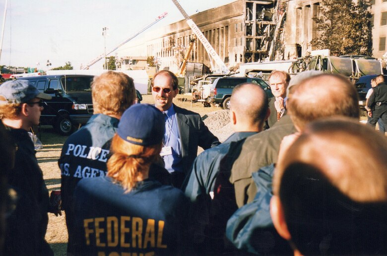 Former NCIS Director David Brunt addresses the NCIS team working at the Pentagon 9-11 attack site.