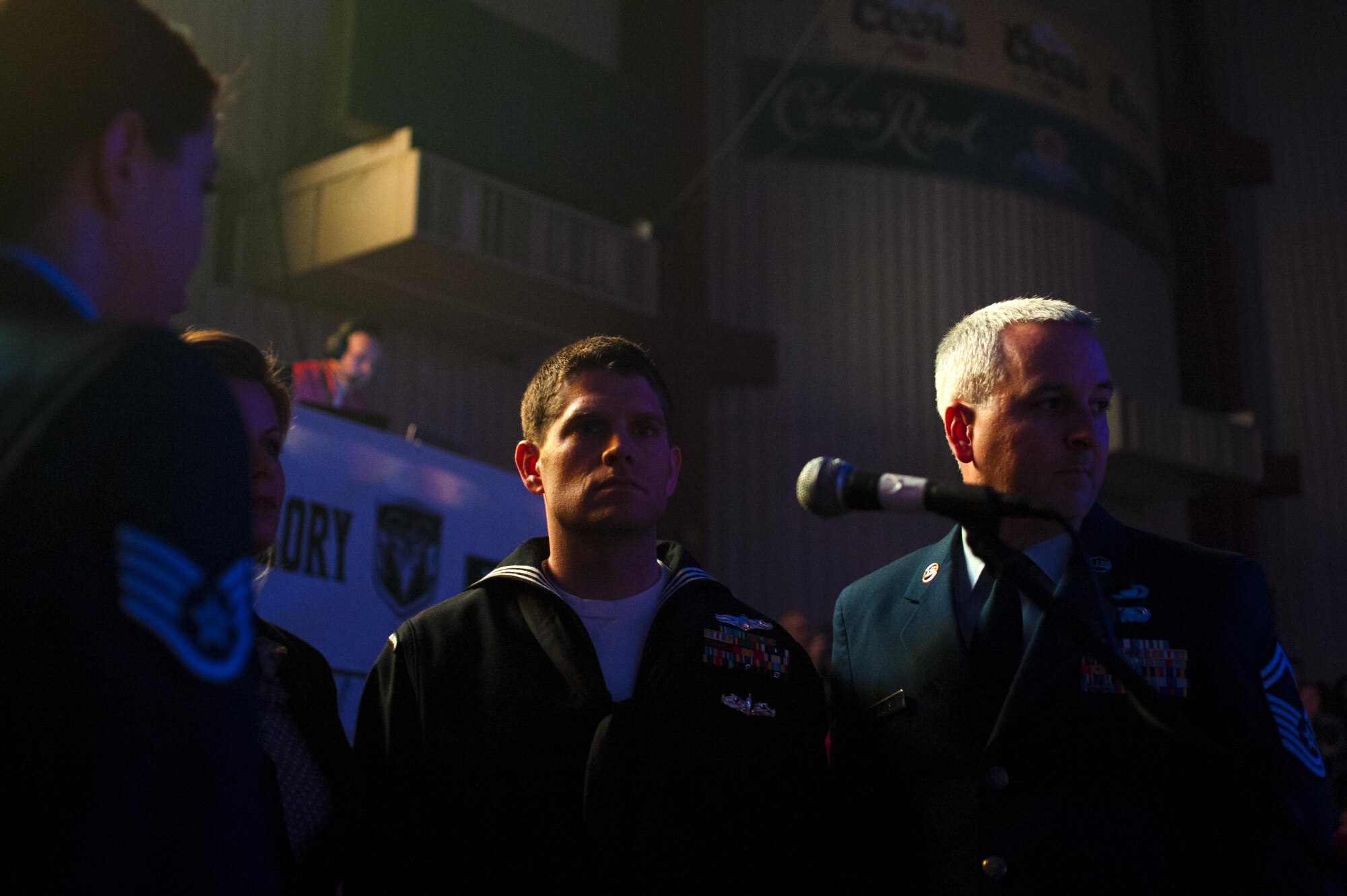 Goodfellow Air Force Base’s Patriotic Blue wait for their cue to sing the national anthem during the San Angelo Stock Show and Rodeo Military Appreciation Night at the Foster Communications Coliseum, San Angelo, Texas, Feb. 17, 2016. San Angelo and Goodfellow have a positive relationship and this night is one way San Angelo shows its gratitude. (U.S. Air Force photo by Senior Airman Scott Jackson/Released)