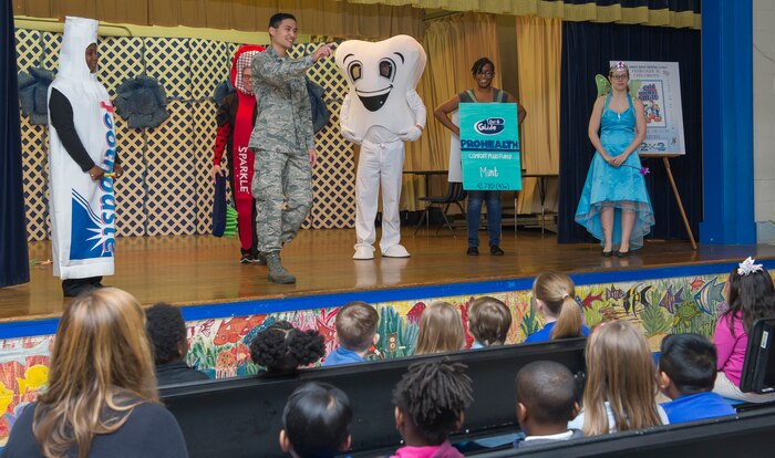 Captain Khiem Nguyen, 628th Medical Group general dentist, speaks to elementary school classes about dental hygiene at Lambs Elementary School on Feb. 11, 2016. Nguyen and members of his dental clinic team are visiting local children centers and elementary schools during children’s dental health month. (U.S. Air Force photo/Airman 1st Class Thomas T. Charlton)
