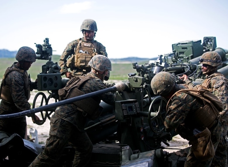 Marines work together to load a 155mm round into the M777 Howitzer cannon during a battery-level fire exercise at Camp Pendleton, Calif., Feb. 10, 2016. The battery participated in a fire exercise in preparation for their upcoming deployment with the 31st Marine Expeditionary Unit. This exercise was the first time the battery used the Digital Firing Control System, a computer that shows grid coordinates of targets and accompanying information. This system is important because it provides a faster response time than using iron sights to fire the howitzer. The Marines are with Battery F, 2nd Battalion, 11th Marine Regiment, 1st Marine Division. (U.S. Marine Corps Photo by Lance Cpl. Justin E. Bowles)