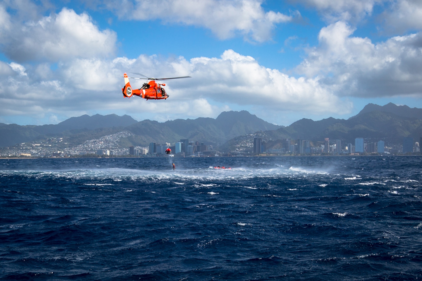 HONOLULU, Hawaii (Feb. 17, 2016) -  A Coast Guard rescue team from Coast Guard Station Barbers Point extracts U.S. Army pilots of 2-6 Cavalry Regiment, 25th Combat Aviation from the ocean approx. one mile off the coast of Honolulu.  The Soldiers conducted training with Coast Guard rescue teams to prepare them for rescue operations in the event of a downed aircraft over water. (Photo by Sgt. Daniel K. Johnson, 25th Combat Aviation Brigade Public Affairs)
