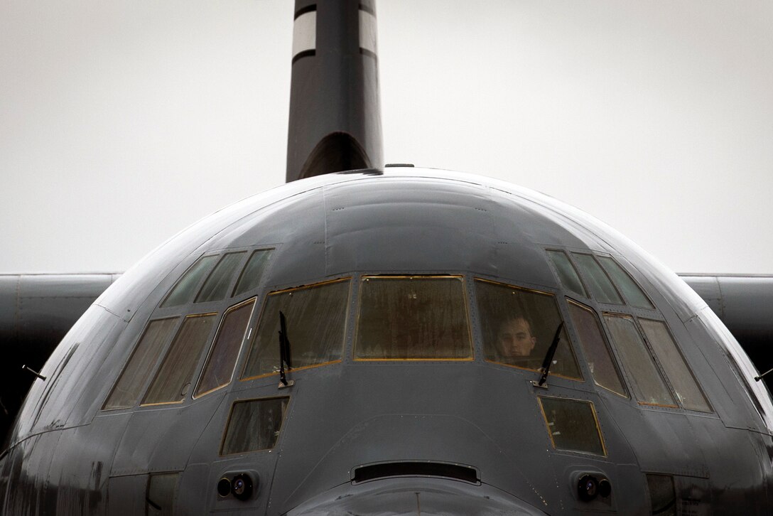 An Air Force aircrew member conducts a preflight inspection on a C-130J Super Hercules during “large package week” training operations on Pope Army Airfield, N.C., Feb. 4, 2016. The training helps prepare airmen and soldiers for a subsequent joint access exercise. Air Force photo by Staff Sgt. Marianique Santos