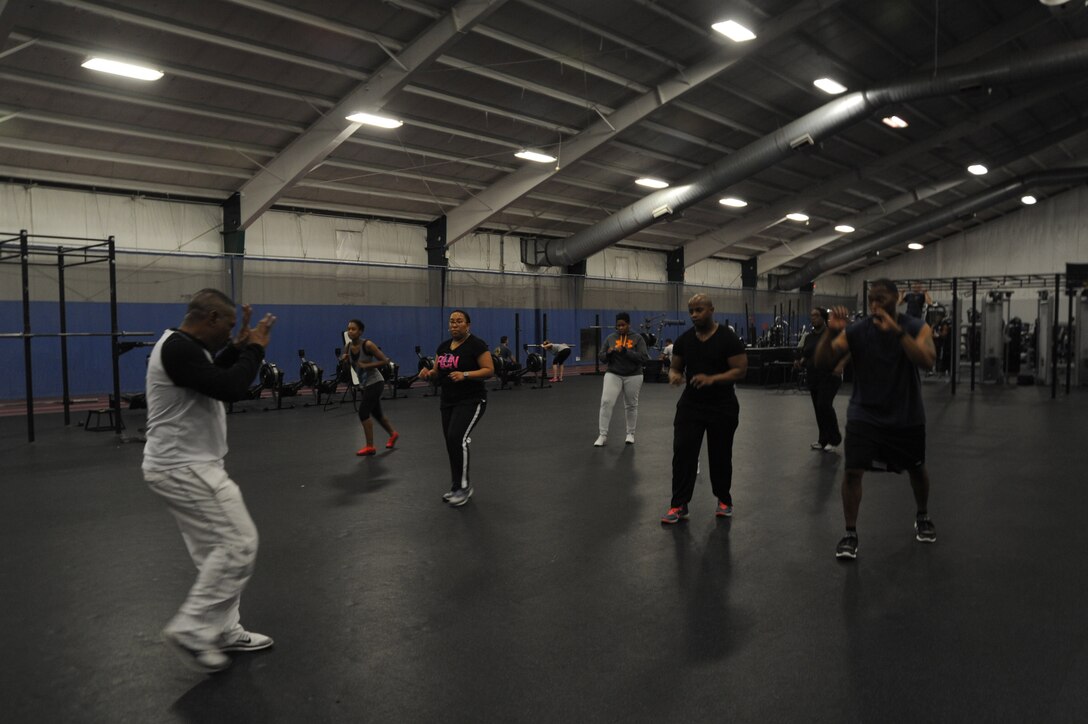 February is American Heart Awareness month, which brings
awareness to the prevention of heart disease and promote activities designed
to combat it. Greg Williams, a U.S. Army veteran and certified personal
fitness trainer, teaches a kickboxing class to members from the 779th MDG. (U.S. Air Force photo/Makeda Knott/released)
