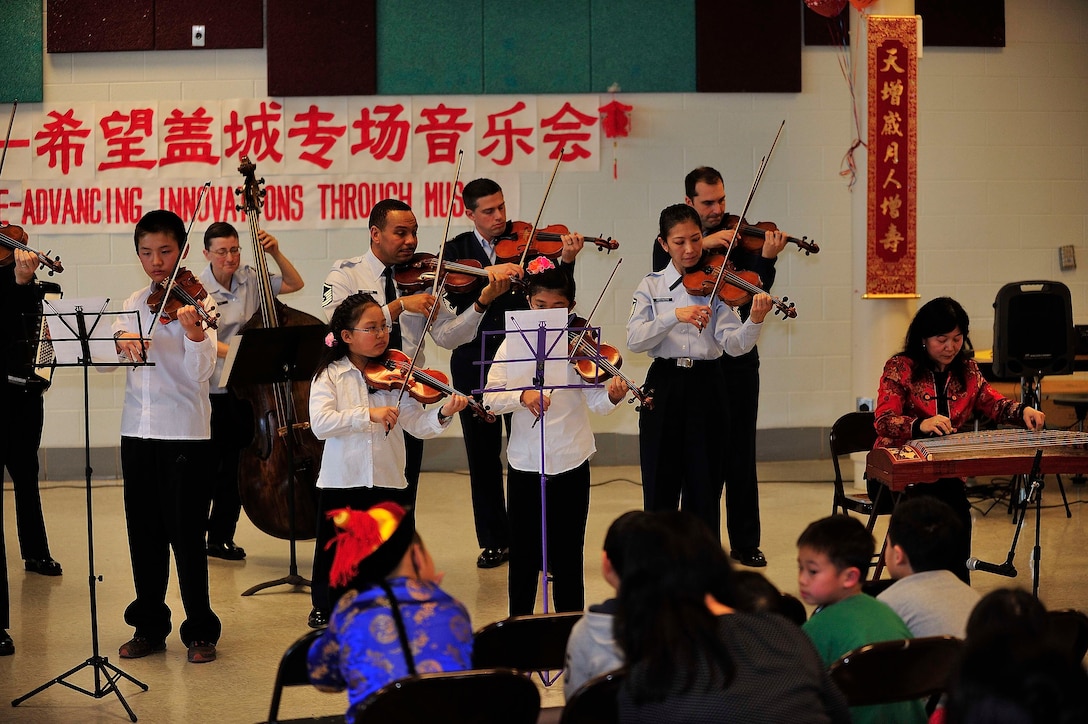 Students of the Hope Chinese Immersion School perform alongside members of the Air Force Strings. The performance, celebrating Chinese New Year, was part of The U.S. Air Force Band's educational outreach program. (Photo courtesy Hope Chinese Immersion School/released)