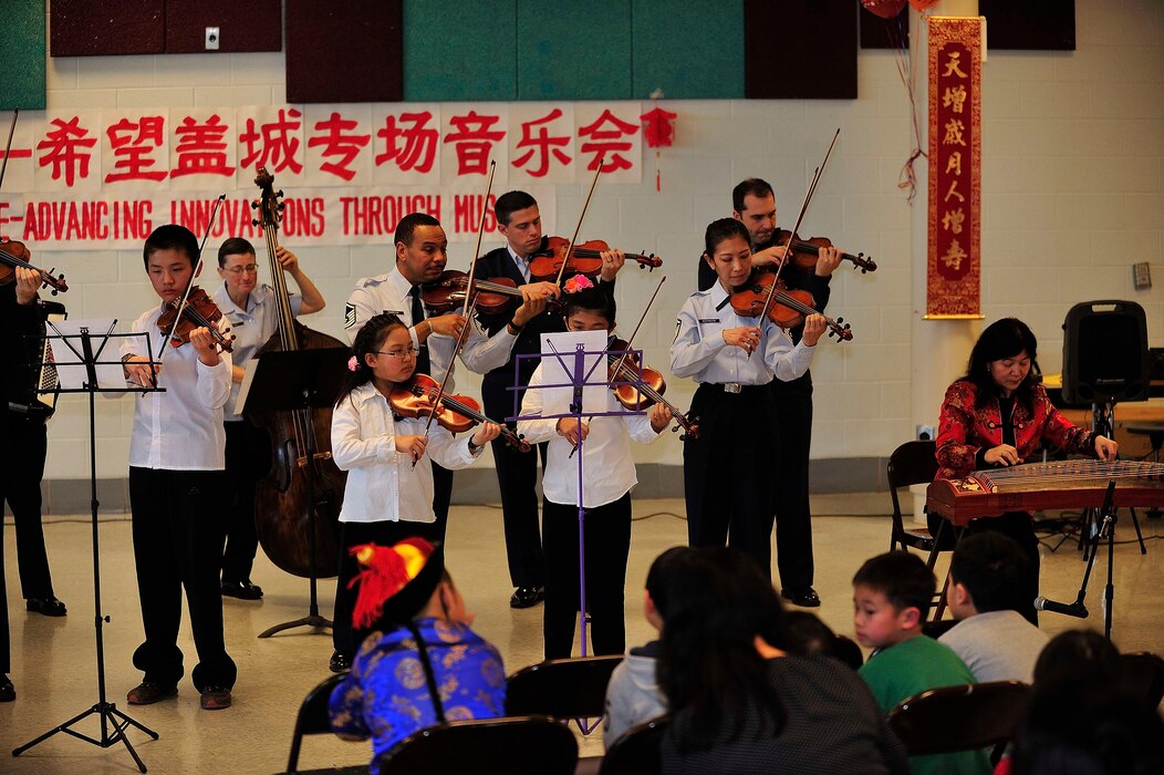 Students of the Hope Chinese Immersion School perform alongside members of the Air Force Strings. The performance, celebrating Chinese New Year, was part of The U.S. Air Force Band's educational outreach program. (Photo courtesy Hope Chinese Immersion School/released)
