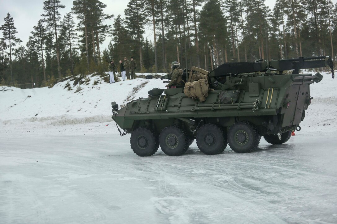 U.S. Marines with Combined Arms Company break loose their Light Armored Vehicles during the ice driving course in Rena, Norway, Feb. 17, 2016. The Marines were getting behind the wheel on the icy pathway in order to understand how to control their heavy vehicles on the slick terrain. The Marines worked and learned alongside members of the Norwegian Army in order to better understand how one another operate. (U.S. Marine Corps photo by Cpl. Dalton A. Precht/released)