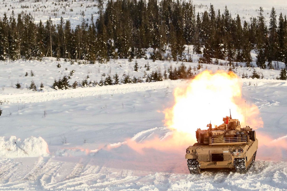 A M1A1 Abrams Tank fires its main gun as it takes part in a live-fire exercise in Rena, Norway, Feb. 18, 2016. The Marines are preparing themselves for Exercise Cold Response 16, which will bring together 12 NATO allies and partner nations and approximately 16,000 troops in order to enhance joint crisis response capabilities in cold weather environments. (U.S. Marine Corps photo by Cpl. Dalton A. Precht/released)