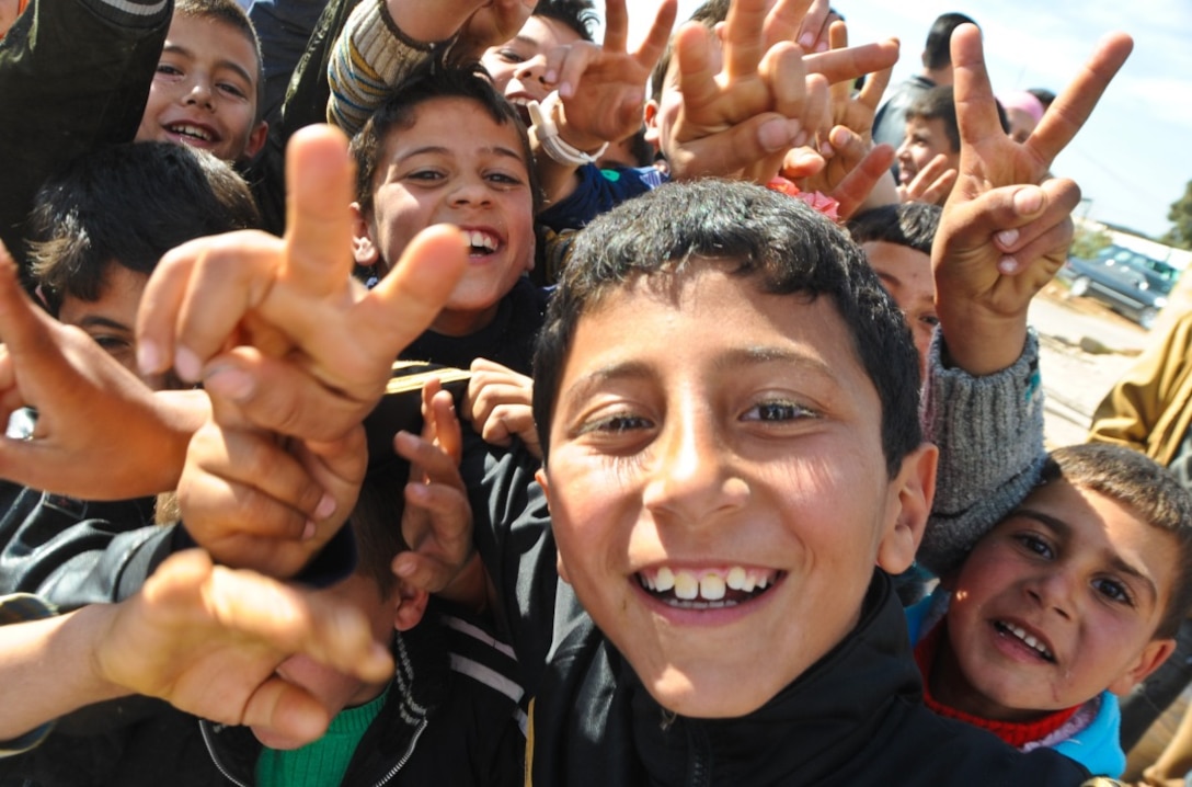 Syrian children at Tal Shehab Reception Center in northern Jordan after braving sniper fire to cross from Syria.