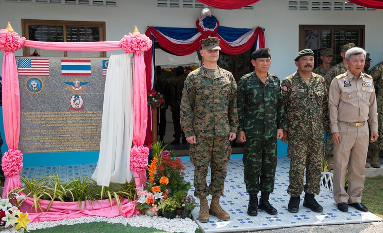 Left to right: U.S. Marine Corps Brig. Gen. Russell Sanborn, commanding general of 1st Marine Aircraft Wing, III Marine Expeditionary Force; Royal Thai Army Gen. Wichien Sirisoonthorn, Royal Thai Armed Forces Headquarters ; Malaysian Army Lt. Col. Made Trika, Malaysian Armed Forces; Mr. Channa Eiumsang, governor of Trat Province. The distinguished visitors pose for a photo in front of the newly dedicated one-room multi-purpose educational building Feb. 18 at Ban Sa Yai, Trat, Thailand. The construction at Ban Sa Yai was one of six humanitarian civic action sites in which the Thai, U.S. and partner nation’s militaries will worked together on civic programs during Cobra Gold 2016. Cobra Gold, in its 35th iteration, demonstrates the commitment of the Kingdom of Thailand and the U.S. to our long-standing alliance and regional partnership toward advancing prosperity and security in the Indo-Asia Pacific region.  (U.S. Marine Corps photo by SSgt. Jose O. Nava/Released)