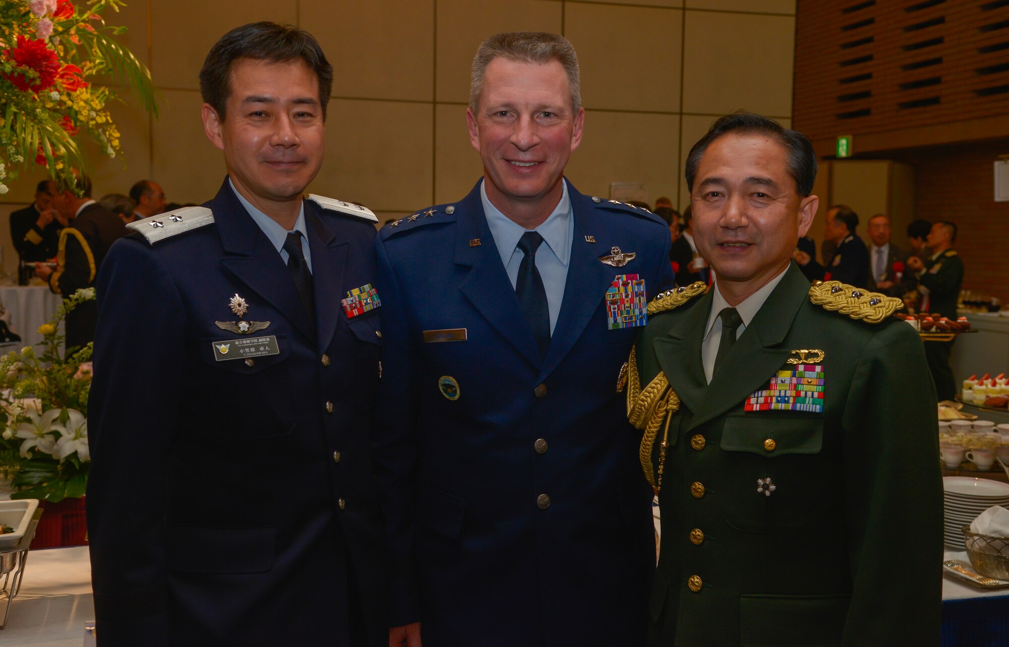 Lt. Gen. John L. Doland, U.S. Forces, Japan and 5th Air Force commander, center, poses for a photo with Japan Ground Self-Defense Force Maj. Gen. Takuto Ogasawara, Joint Staff College Ministry of Defense vice commandant, left, and Japan Air Self-Defense Force Lt. Gen. Koji Yamazaki, JSMD vice chief of staff, during the Japan Joint Staff 10th anniversary ceremony at Hotel Grand Hill, Ichigaya, Japan, Feb. 17, 2016. The event consisted of opening remarks from senior leadership, breaking sake barrels and discussions between military personnel to strengthen bilateral relationships. (U.S. Air Force photo by Senior Airman David Owsianka/Released)