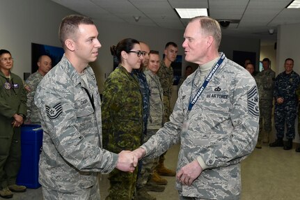 The Chief Master Sgt. of the Air Force James Cody  visited Peterson Air Force Base, Colorado, February 10-12, to meet with Airmen from nearby bases and tour North American Aerospace Defense Command and U.S. Northern Command. Cody also gave thanks to the Canadian and interagency counterparts working shoulder-to-shoulder with U.S. servicemembers, stopping to present recognition coins to four U.S. and one Canadian enlisted member for excellence.


