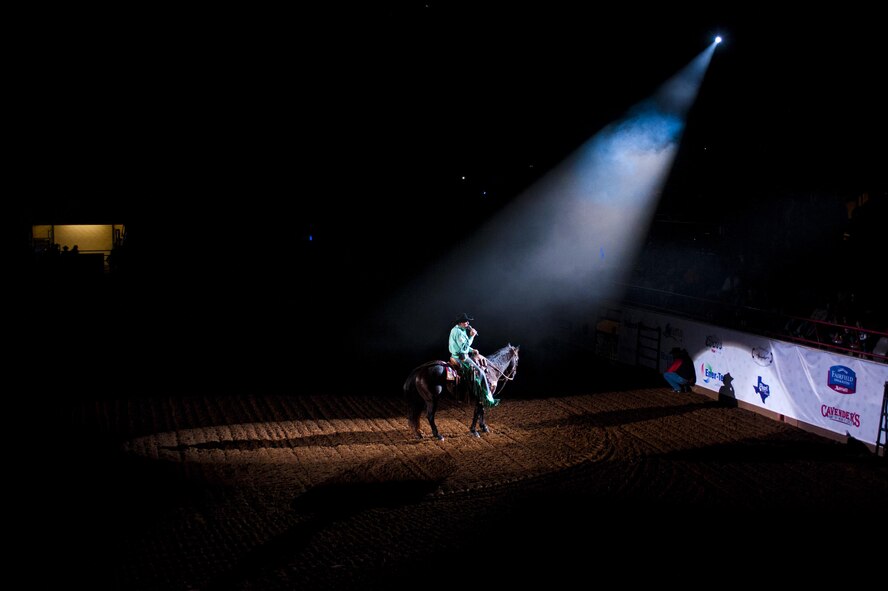 Boyd Polhamus, San Angelo Stock Show and Rodeo announcer, gives his opening remarks for Military Appreciation Night at the Foster Communications Coliseum, San Angelo, Texas, Feb. 17, 2016. The San Angelo Stock Show and Rodeo started in 1932, making it one of the longest running rodeo shows in the world. (U.S. Air Force photo by Senior Airman Scott Jackson/Released)