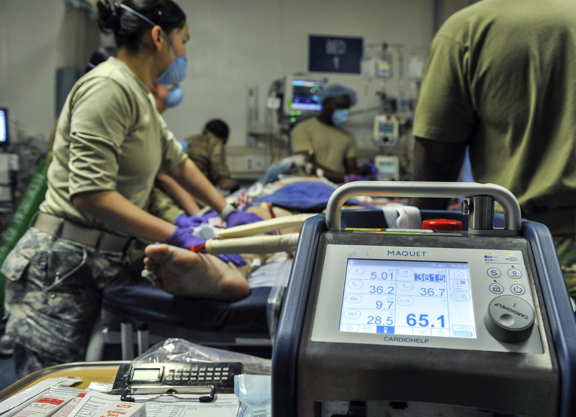 A 455th Expeditionary Medical Group team combines efforts with the Extracorporeal Membrane Oxygenation team to save the life of a NATO ally at the Craig Joint-Theater Hospital at Bagram Air Field, Afghanistan, on Feb. 18, 2016. The ECMO team, dispatched from San Antonio Military Medical Center, uses technology that bypasses the lungs and infuses the blood directly with oxygen, while removing the harmful carbon dioxide from the blood stream. The patient was airlifted to Landstuhl Regional Medical Center, Germany, where he will receive 7 to 14 days of additional ECMO treatment. (U.S. Air Force photo by Tech. Sgt. Nicholas Rau)