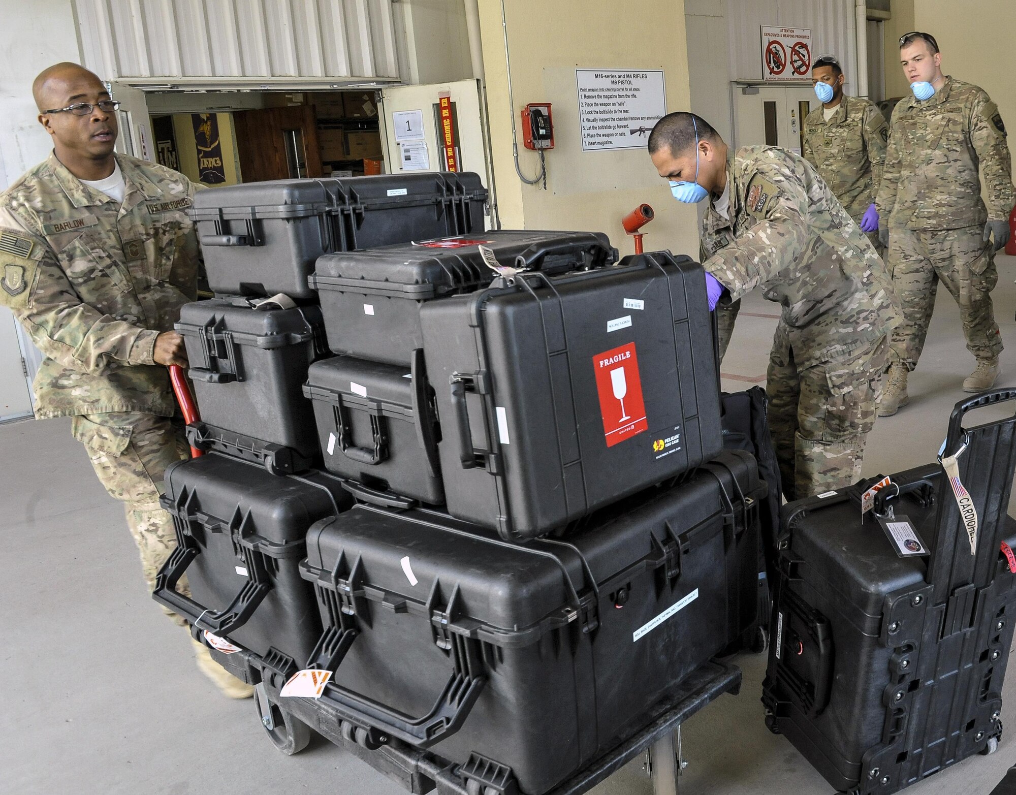 A 455th Expeditionary Medical Group team handles the Extracorporeal Membrane Oxygenation team’s equipment during a patient transfer at the Craig Joint-Theater Hospital at Bagram Air Field, Afghanistan, on Feb. 18, 2016. The ECMO team, dispatched from San Antonio Military Medical Center, uses technology that bypasses the lungs and infuses the blood directly with oxygen, while removing the harmful carbon dioxide from the blood stream. The patient was airlifted to Landstuhl Regional Medical Center, Germany, where he will receive 7 to 14 days of additional ECMO treatment. (U.S. Air Force photo by Tech. Sgt. Nicholas Rau)