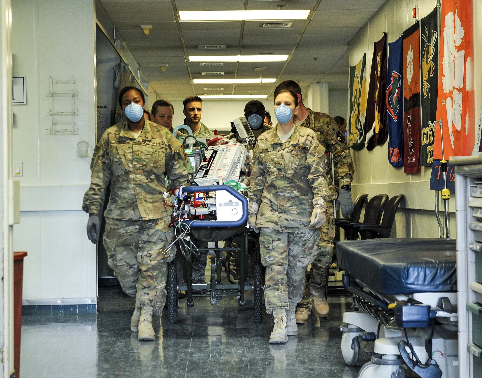 A 455th Expeditionary Medical Group team combines efforts with the Extracorporeal Membrane Oxygenation team to transport a NATO ally at the Craig Joint-Theater Hospital at Bagram Air Field, Afghanistan, on Feb. 18, 2016. The ECMO team, dispatched from San Antonio Military Medical Center, uses technology that bypasses the lungs and infuses the blood directly with oxygen, while removing the harmful carbon dioxide from the blood stream. The patient was airlifted to Landstuhl Regional Medical Center, Germany, where he will receive 7 to 14 days of additional ECMO treatment. (U.S. Air Force photo by Tech. Sgt. Nicholas Rau)