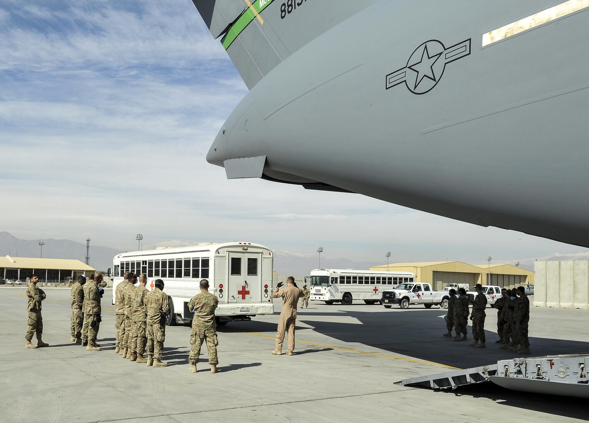 A 455th Expeditionary Medical Group team prepares to load a NATO ally, who required Extracorporeal Membrane Oxygenation team support, onto an aeromedical evacuation transport at Bagram Air Field, Afghanistan, on Feb. 18, 2016. The ECMO team, dispatched from San Antonio Military Medical Center, uses technology that bypasses the lungs and infuses the blood directly with oxygen, while removing the harmful carbon dioxide from the blood stream. The patient was airlifted to Landstuhl Regional Medical Center, Germany, where he will receive 7 to 14 days of additional ECMO treatment. (U.S. Air Force photo by Tech. Sgt. Nicholas Rau)