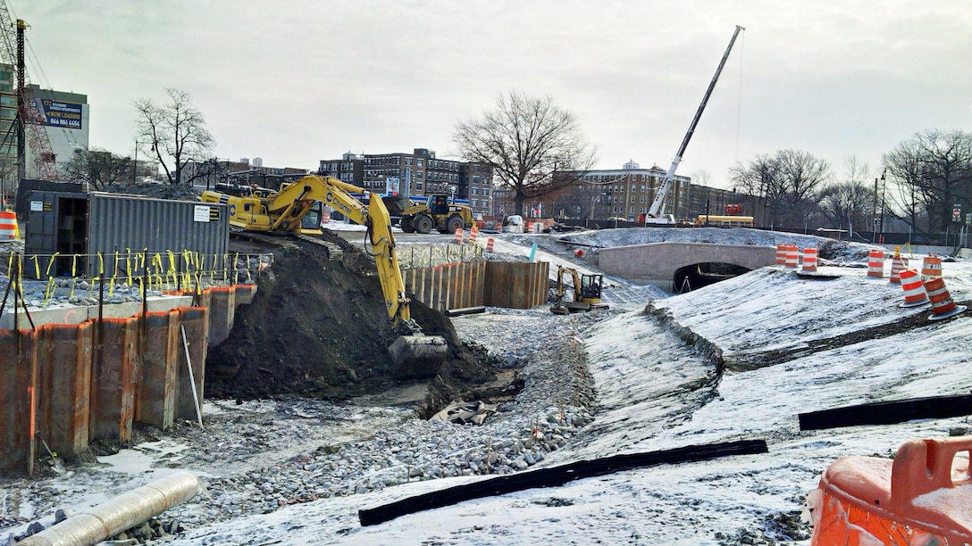 Excavating the last of the material from the southside of the former Sears Parking Lot to form the new flood risk management channel – January 14, 2016. Muddy River Flood Risk Management and Environmental Restoration.