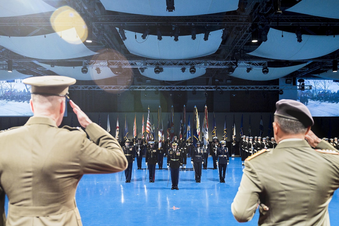 Marine Corps Gen. Joseph F. Dunford Jr., left, chairman of the Joint Chiefs of Staff, and Gen. Gatot Nurmantyo, commander in chief of the Indonesian National Defense Forces, render honors during a ceremony welcoming Nurmantyo to Joint Base Myer-Henderson Hall, Va., Feb. 18, 2016. DoD photo by Army Staff Sgt. Sean K. Harp