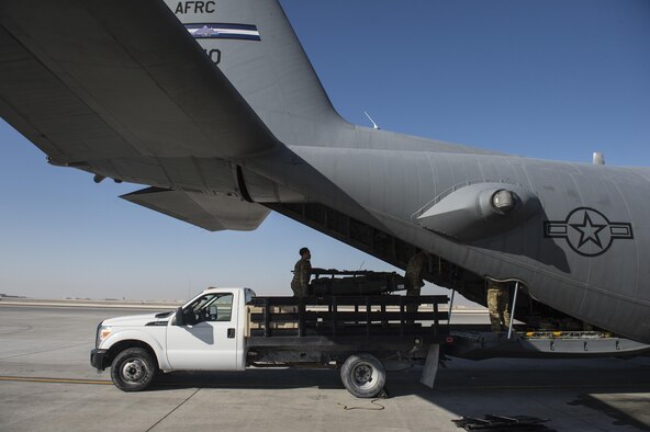 Members of the 379th Expeditionary Aeromedical Evacuation Squadron load a C-130 Hercules with medical equipment at Al Udeid Air Base, Qatar, Feb. 11, 2016. A typical 379th EAES mission includes transporting patients to locations with more definitive medical care or returning recovered personnel to duty at their deployed locations. (U.S. Air Force photo/Staff Sgt. Corey Hook)