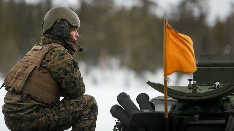 Cpl. Cody Stoffel, an amphibious assault vehicle crewman with Combined Arms Company, gives firing commands to the gunner of an amphibious assault vehicle crewman as Marines with 2nd Marine Expeditionary Brigade conduct a live-fire exercise in the frozen hills of Rena, Norway, Feb. 17, 2016. The Marines are preparing themselves for Exercise Cold Response 16, which will bring together 12 NATO allies and partner nations and approximately 16,000 troops in order to enhance joint crisis response capabilities in cold weather environments.  