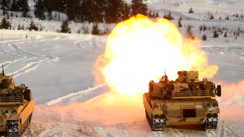 A U.S. Marine Corps M1A1 Abrams Tank creates some warmth as it takes part in a live-fire exercise in Rena, Norway, Feb. 18, 2016. Tanks with Combined Arms Company took to the firing line as part of a training exercise integrating both U.S. and Norwegian forces. The Marines and Norwegians are preparing themselves for Exercise Cold Response 16, which will bring together 12 NATO allies and partner nations and approximately 16,000 troops in order to enhance joint crisis response capabilities in cold weather environments. 