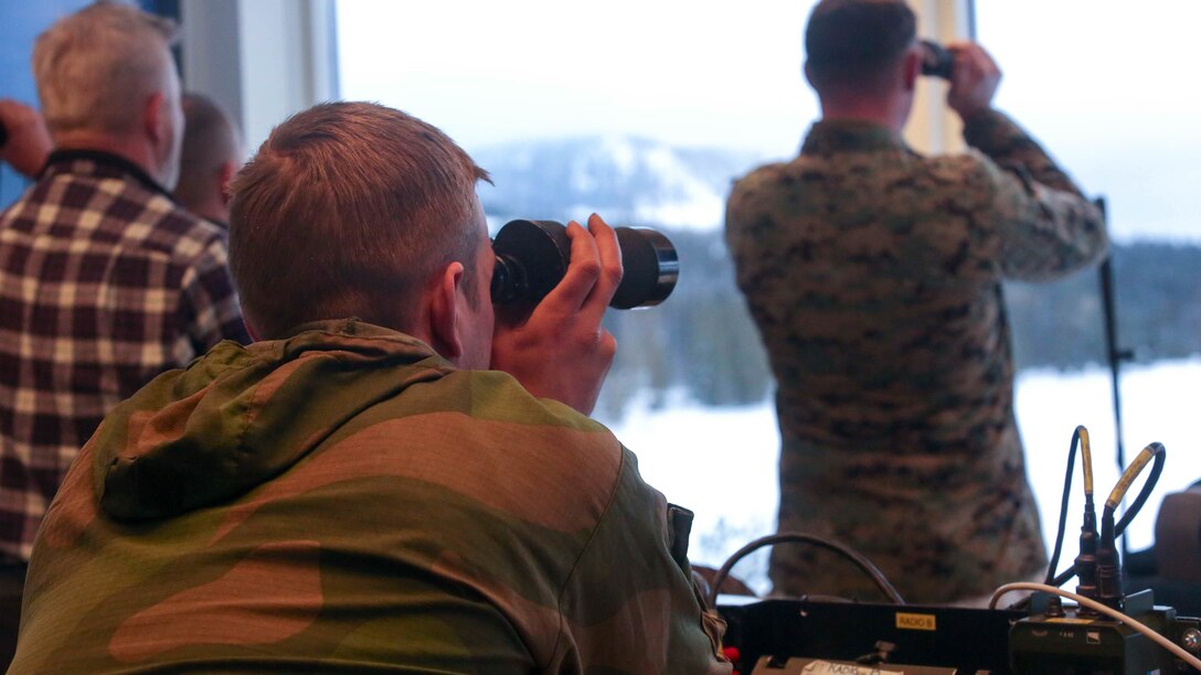 A member of the Norwegian Army looks at the down range area as U.S. Marines conduct a live-fire exercise in Rena, Norway, Feb. 17, 2016. The Marines are preparing themselves for Exercise Cold Response 16, which will bring together 12 NATO allies and partner nations and approximately 16,000 troops in order to enhance joint crisis response capabilities in cold weather environments.