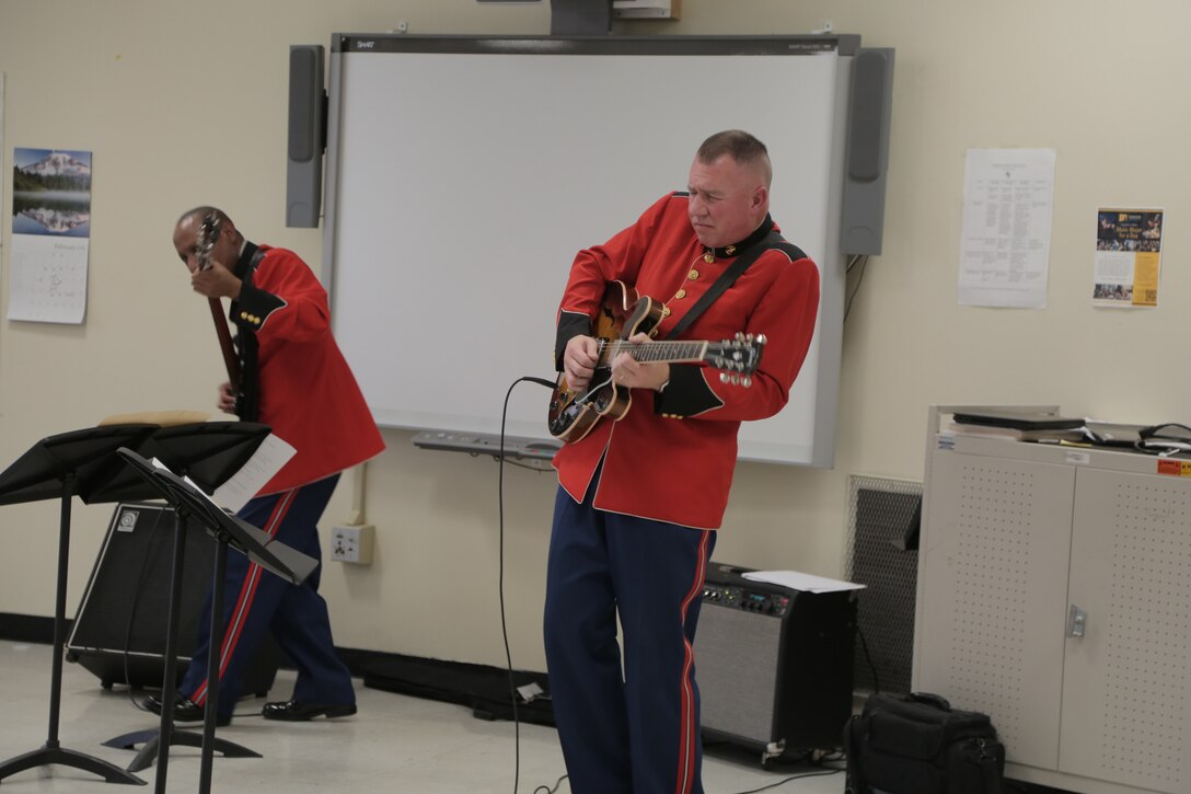 On Feb. 17, 2016, a jazz combo from "The President's Own" U.S. Marine Band presented a Music in the High Schools program at Fairmont Heights High School in Capitol Heights, Md. The performance included music from the combo's "musical heroes." At the conclusion of the program one of the students raised his hand and said, "I've only been playing the bass for three months. I didn't know you could make it sing like that." He pointed to the combo's bass player and said, "He is my musical hero!" (U.S. Marine Corps photo by Master Sgt. Kristin duBois/released)