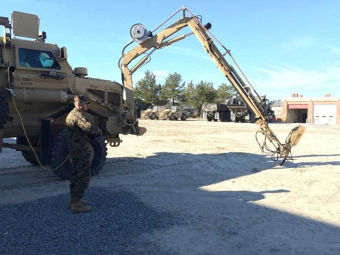 On January 21, 2016 Second Lieutenant David A. Calderon operates the articulating arm of the Buffalo Heavy Mine-Protected Clearance Vehicle during a clearance assets practical application at Marine Corps Engineer School, Camp Lejeune, N.C. The Buffalo is a valuable asset for combat engineers during route reconnaissance and clearance operations. It is purpose-built for mine clearing and adapted to the interrogation of suspected explosive hazards. 
