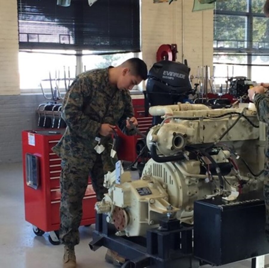 As part of the Small Craft Mechanics Course 2-16 (SCMC 2-16) at Marine Corps Engineer School, Camp Lejeune, N.C. students learn how to tear down, inspect, troubleshoot, and rebuild engines. Here a Marine rebuilds an engine as part of a practical application.
