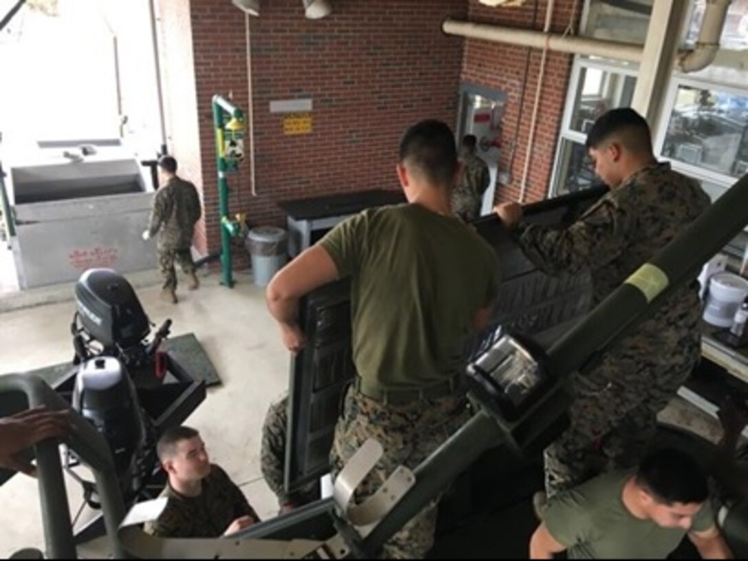 As part of the Small Craft Mechanics Course 2-16 (SCMC 2-16) at Marine Corps Engineer School, Camp Lejeune, N.C. students learn how to disassemble components of the powerhead, and how to tear down, inspect, troubleshoot, and rebuild engines.  Here a group of Marines remove the connecting rod from the piston.


