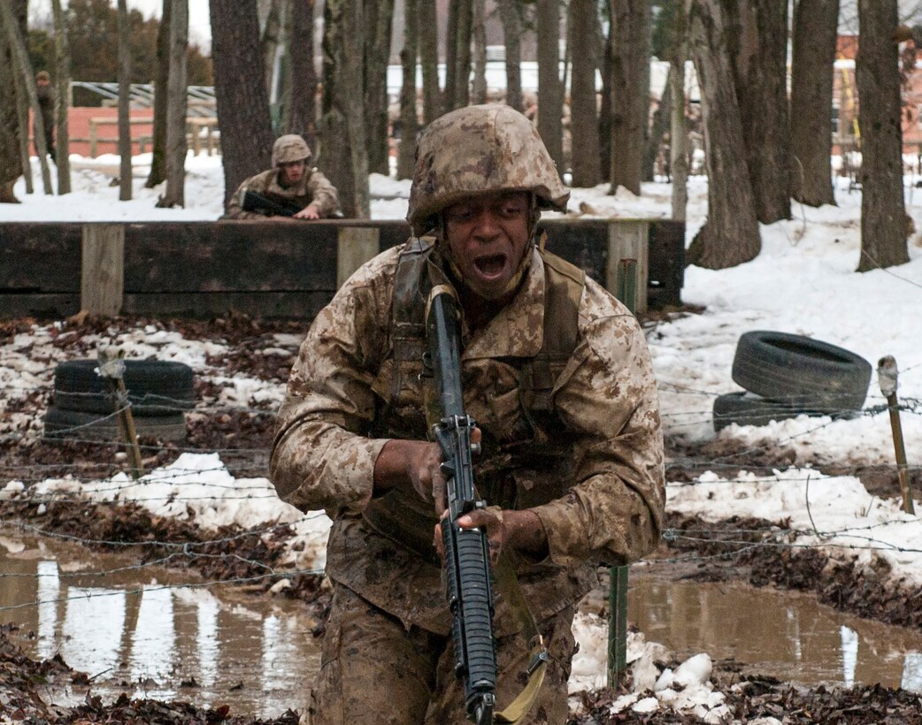 Candidates assigned to Delta Company, Officer Candidates Class-221, work together to complete the Buddy Team Fire and Movement Course at Brown Field, Marine Corps Base Quantico, on Jan. 28. The mission of Officer Candidates School (OCS) is to “educate and train officer candidates in Marine Corps knowledge and skills within a controlled, challenging, and chaotic environment in order to evaluate and screen individuals for the leadership, moral, mental, and physical qualities required for commissioning as a Marine Corps officer.”
