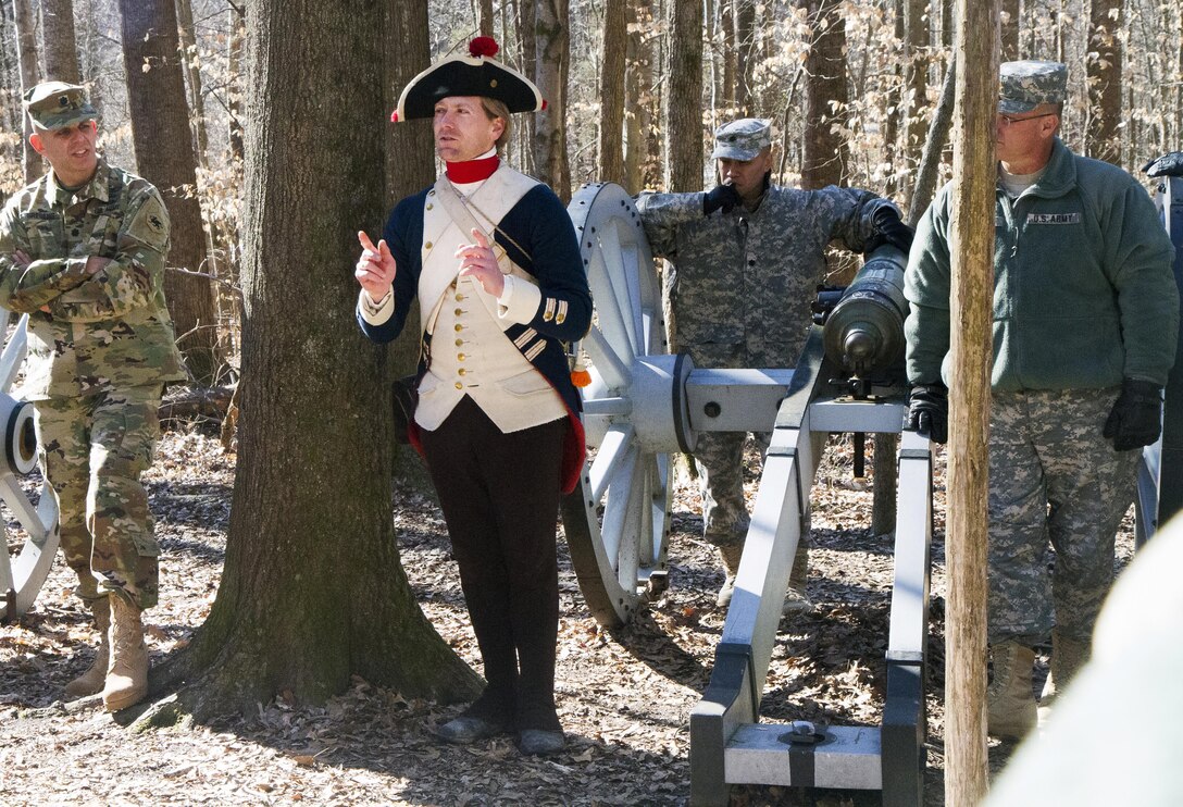 Cristopher Ruff, the Curator of the Army Reserve Museum shown wearing a period correct Continental Soldier's uniform, explains what took place during one of the closing moments of the Battle of Guilford County Courthouse to leaders and Soldiers of the 108th Training Command (IET) during their staff ride on Feb 6 at its site in Greensboro, N.C., which is now a National Park. The staff rides are training events used by staff members of the unit to learn important lessons from the past in order to ensure success in future conflicts. (U.S. Army photo by Sgt. Javier Amador)