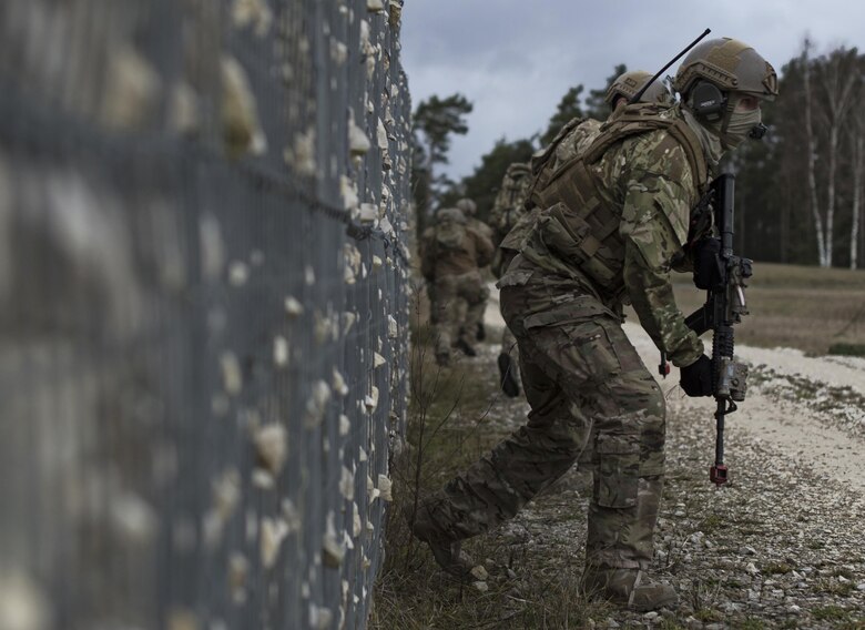 An Airman with the 2nd Air Support Operations Squadron maneuvers to the objective during training at U.S. Army Garrison Bavaria in Vilseck, Germany, Feb. 9, 2016. The training consisted of 2nd ASOS Airmen calling in close air support, neutralizing opposing forces and practicing medical evacuation by helicopter. The Airmen swapped roles as opposing forces and U.S. forces throughout the training to challenge their capabilities in controlling airpower in an urban environment. (U.S. Air Force photo/Senior Airman Jonathan Stefanko)