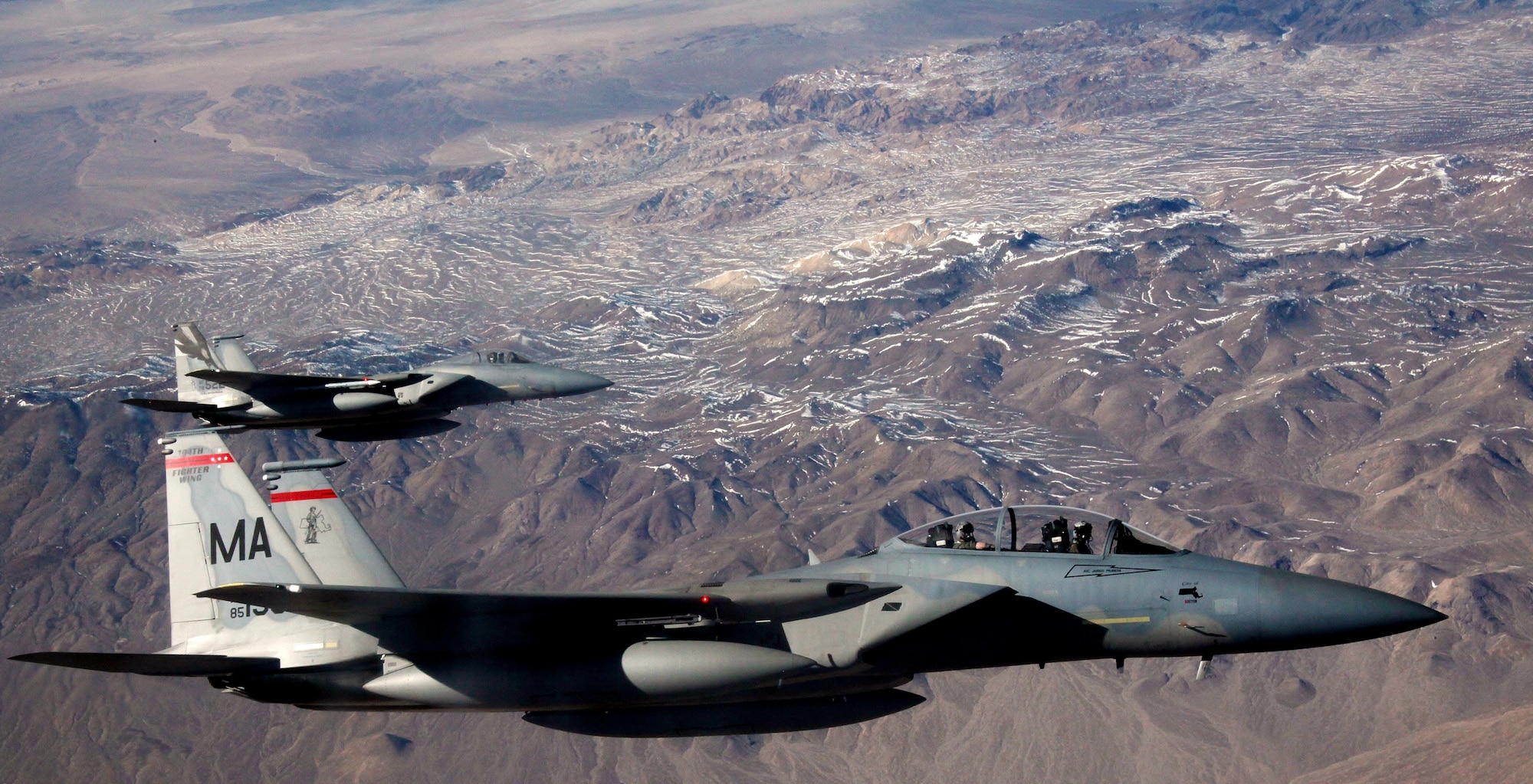 F-15C Eagles assigned to the 131st Fighter Squadron at Barnes Air National Guard Base, Mass., and the 194th Fighter Squadron at Fresno Air National Guard Base, Calif., wait to refuel beside a KC-135 Stratotanker during a Red Flag 16-1 training mission on Feb. 11, 2016. The concept of Red Flag was developed by Maj. Moody Suter to simulate the first 10 combat missions pilots would face. (U.S. Air Force photo/Master Sgt. Burt Traynor)
