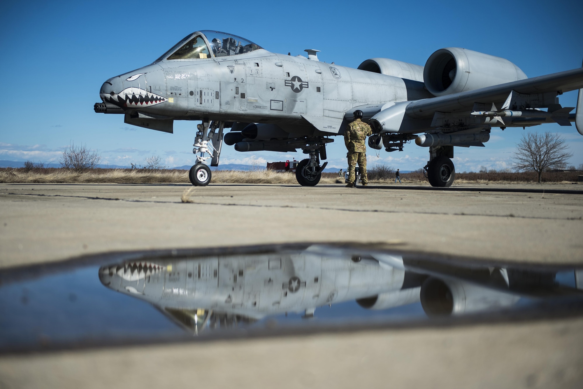 A member of the 100th Logistics Readiness Squadron refuels a 74th Expeditionary Fighter Squadron A-10C Thunderbolt II during forward area refueling point training at Plovdiv, Bulgaria, Feb. 11, 2016. A single A-10 usually receives approximately 2,000 pounds of fuel in a four- to five-minute span during FARP training but the C-130 Hercules can provide tens of thousands of pounds of fuel if needed. (U.S. Air Force photo/Airman 1st Class Luke Kitterman)