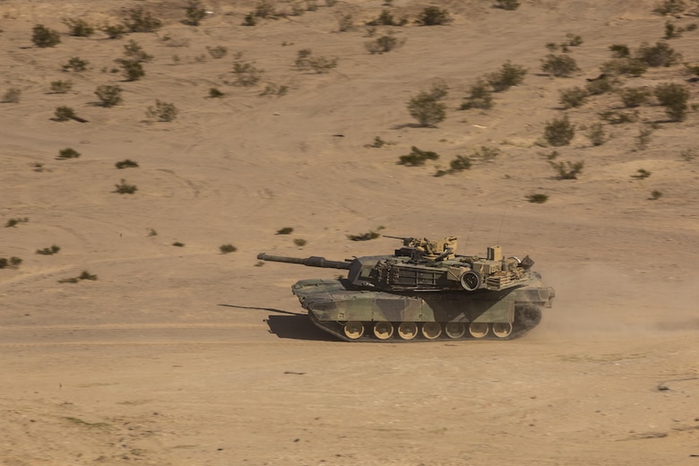 An M1A1 Abrams Main Battle Tanks with Company A, 1st Tank Battalion, scans for adversaries while traversing through the Quackenbush Training Area Tank Mechanized Assault Course as part of Integrated Training Exercise 2-16 aboard the Combat Center Feb. 9, 2016. ITX is designed to prepare units for combat, under the most realistic conditions possible, focusing on battalion and squad level training. (Official Marine Corps photo by Lance Cpl. Levi Schultz/Released)