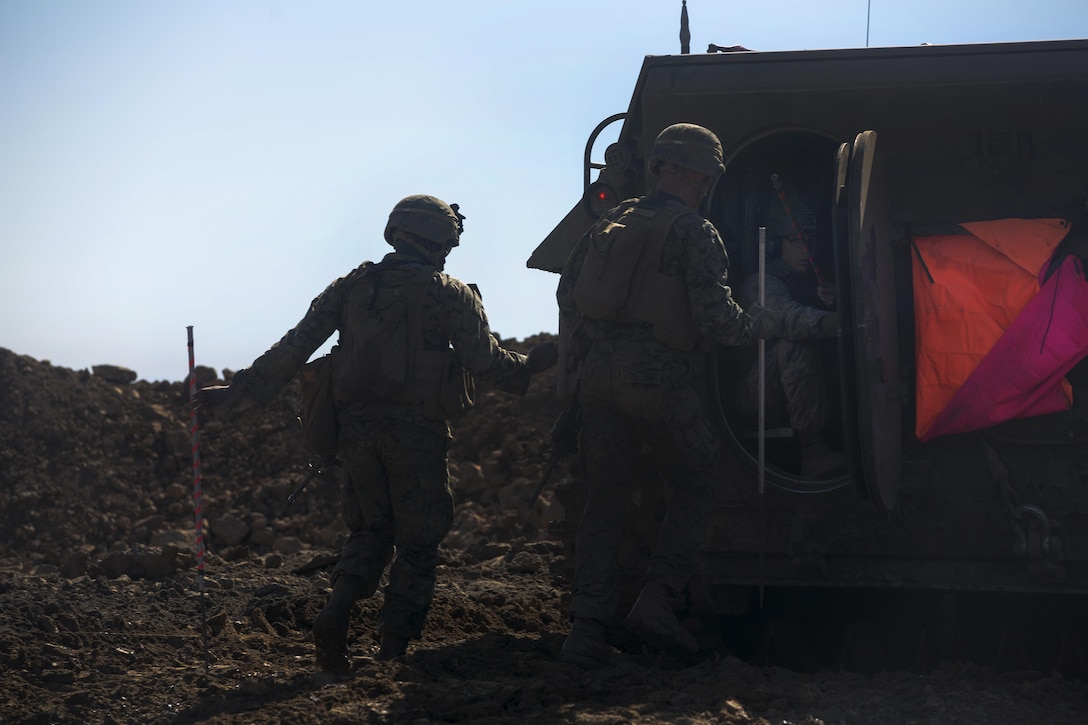Marines place guiding stakes along a path cleared by a mine clearing line charge during breaching training that's part of Exercise Iron Fist conducted on Marine Corps Base Camp Pendleton, Calif., Feb. 4, 2016. Marine Corps photo by Cpl. Garrett White