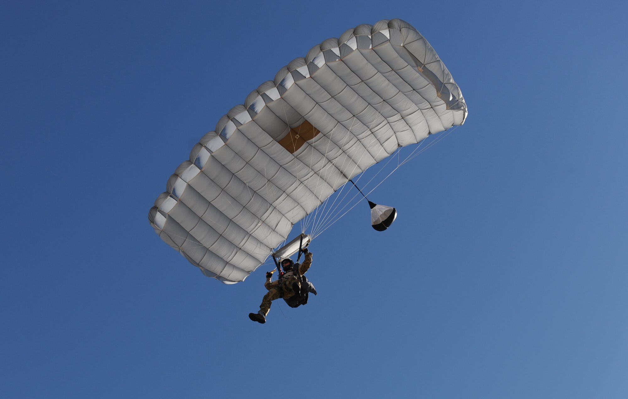Staff Sgt. John, 334th Training Squadron combat control instructor, makes his final approach toward the designated landing zone during a parachute jump Feb. 17, 2016, Keesler Air Force Base, Miss. Keesler’s battlefield Airmen instructors periodically perform the routine training exercise to maintain their proficiency. (U.S. Air Force photo by Kemberly Groue)